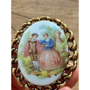 Vintage Fragonard Style Porcelain Brooch With Gold-Toned Chain Frame In Decorati